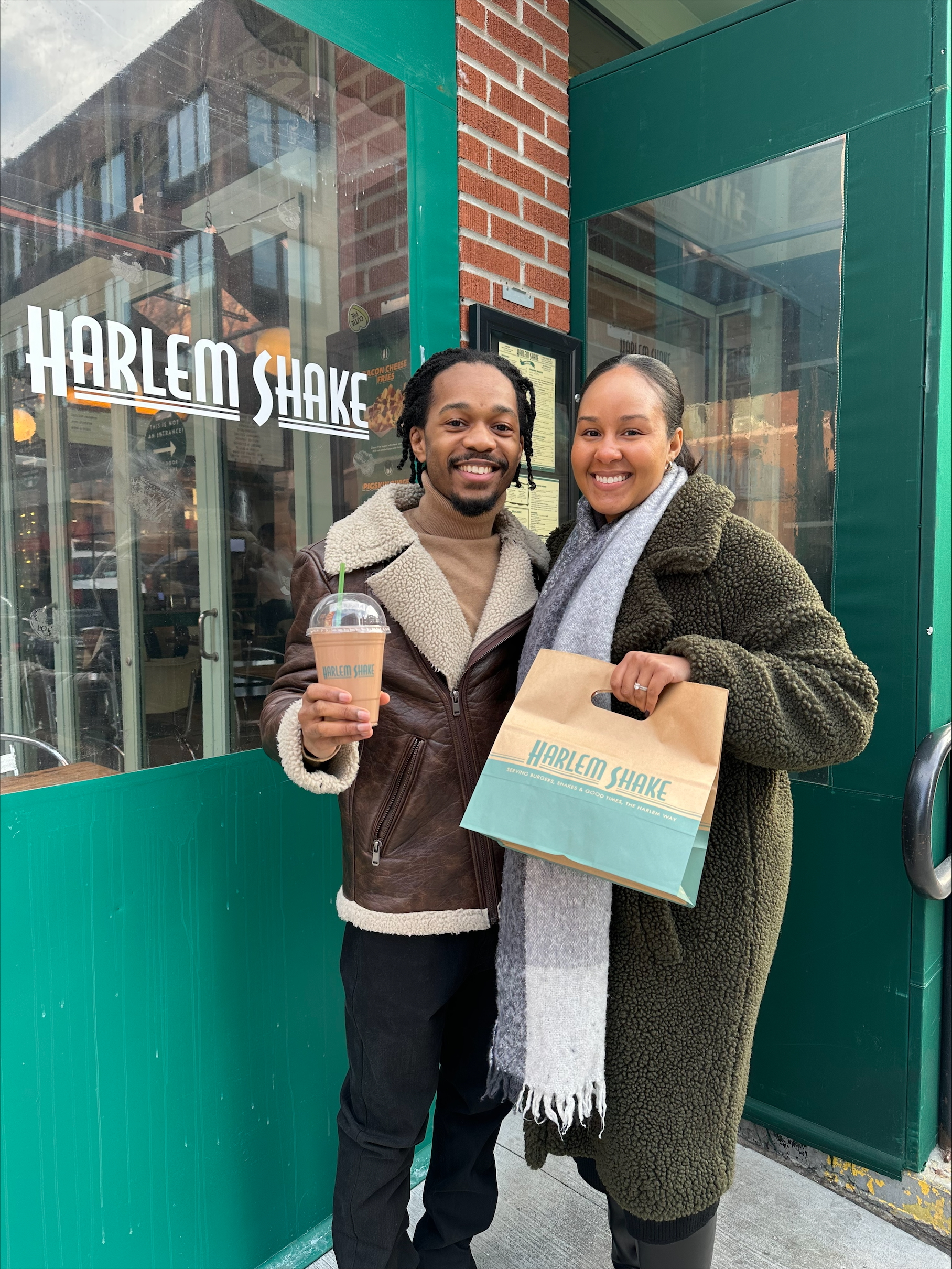 Brooklyn franchisee, Cody with his wife outside of Harlem Shake